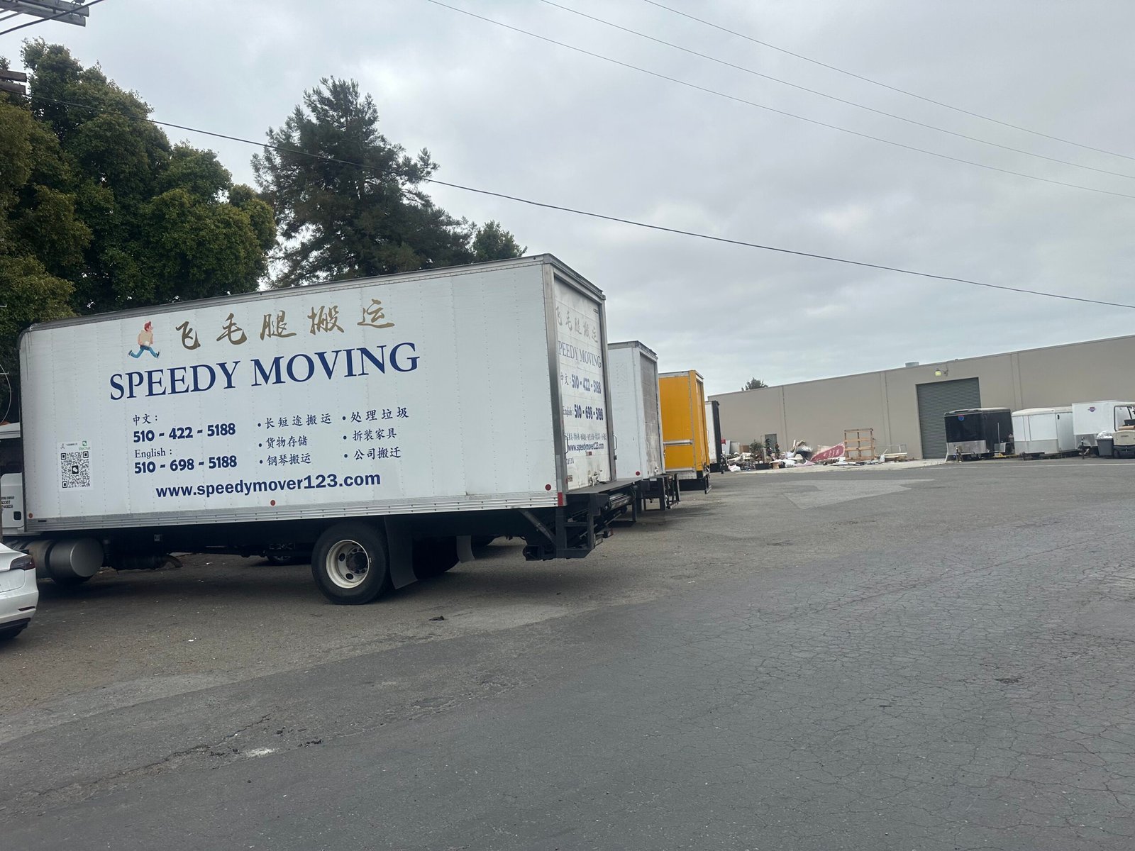 Junk Removal & StorageSpeedy Moving Service LLC Speedy Moving trucks at warehouse for junk removal and storage services